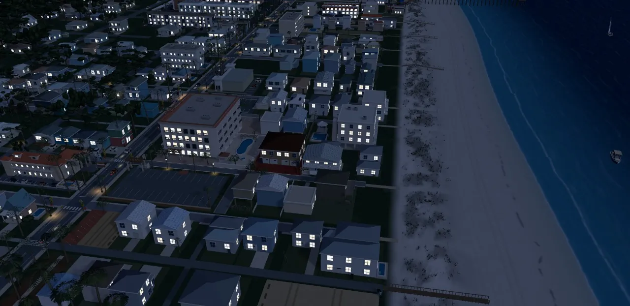 A 3D model of the St. Augustine Beach coast at night, windows lit along the streets beside the dark Atlantic
